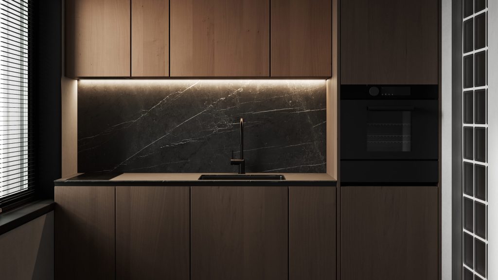 A dark walnut kitchen with tall panelled cabinets and a black stone splashback lit from beneath
