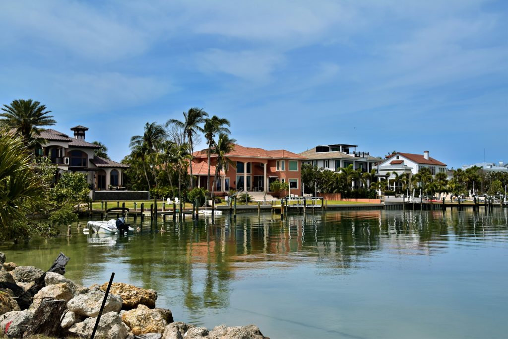 Waterfront houses with private docks on a calm inlet