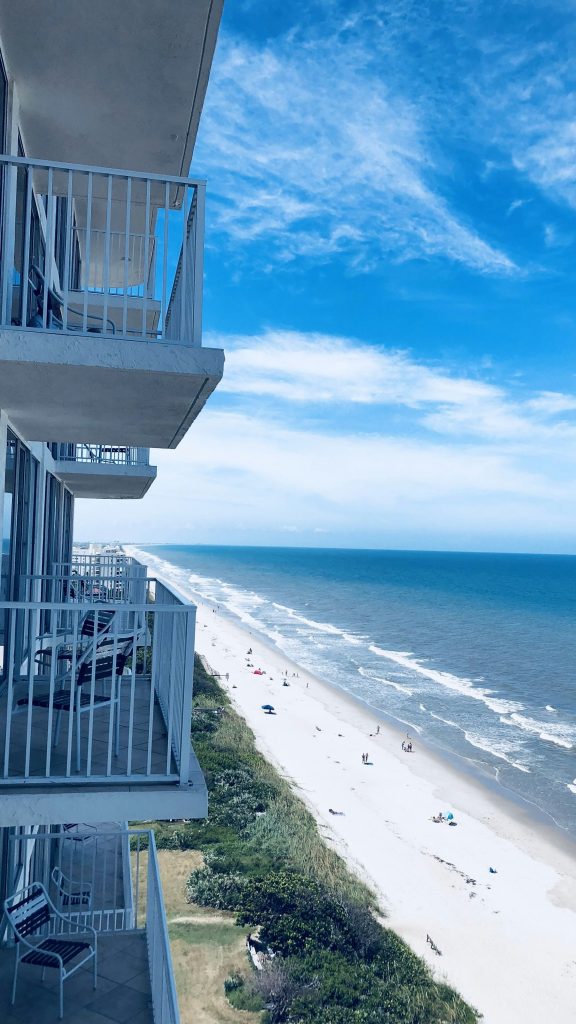 The beach and the ocean from a balcony high on a beachfront tower