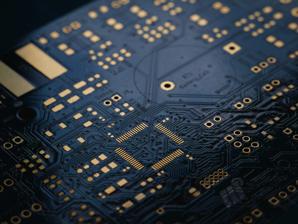 A dark blue circuit board photographed close up