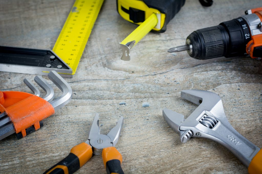 Hand tools laid out on a workbench